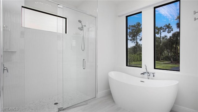 1030 22nd Ave NE, Naples, FL 34120 - full bathroom with a freestanding tub and a stall shower