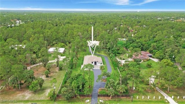 1030 22nd Ave NE, Naples, FL 34120 - view of property location with a heavily wooded area