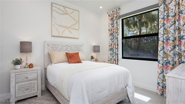 1030 22nd Ave NE, Naples, FL 34120 - bedroom featuring wood finished floors and recessed lighting
