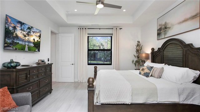 1030 22nd Ave NE, Naples, FL 34120 - bedroom featuring a raised ceiling, light wood finished floors, recessed lighting, and ceiling fan