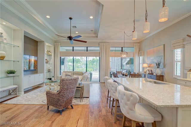 11330 Hidalgo Ct, Fort Myers, FL 33912 - living room featuring light wood-style floors, ceiling fan, a raised ceiling, crown molding, and recessed lighting