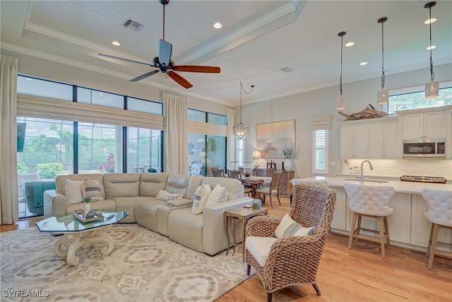 11330 Hidalgo Ct, Fort Myers, FL 33912 - living room with light wood-type flooring, a ceiling fan, crown molding, and recessed lighting
