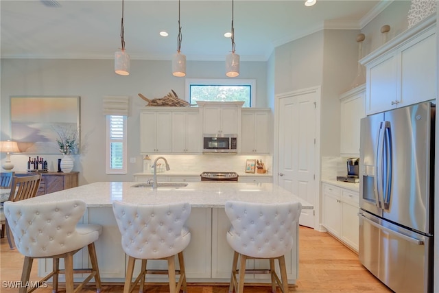 11330 Hidalgo Ct, Fort Myers, FL 33912 - kitchen featuring stainless steel appliances, tasteful backsplash, crown molding, recessed lighting, and white cabinetry