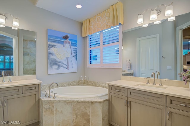 11330 Hidalgo Ct, Fort Myers, FL 33912 - full bathroom featuring two vanities and a garden tub