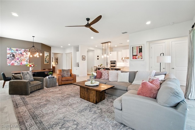 3387 Pilot Cir, Naples, FL 34120 - living area featuring a chandelier, recessed lighting, and a ceiling fan