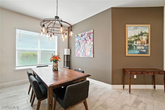 3387 Pilot Cir, Naples, FL 34120 - dining area featuring a chandelier and light wood-style floors