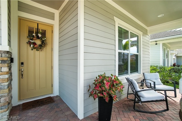 3387 Pilot Cir, Naples, FL 34120 - view of exterior entry with covered porch