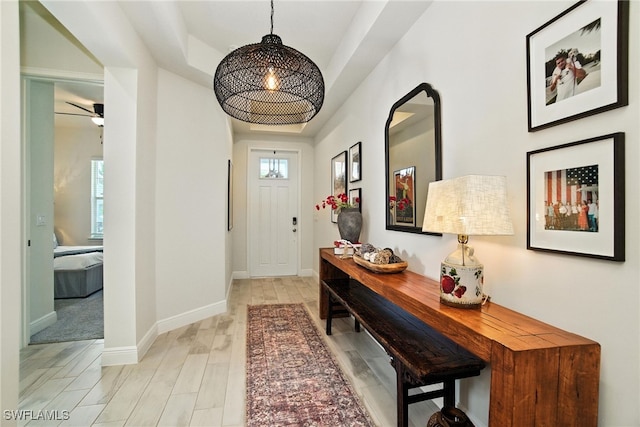 3387 Pilot Cir, Naples, FL 34120 - foyer featuring light wood-type flooring and a ceiling fan