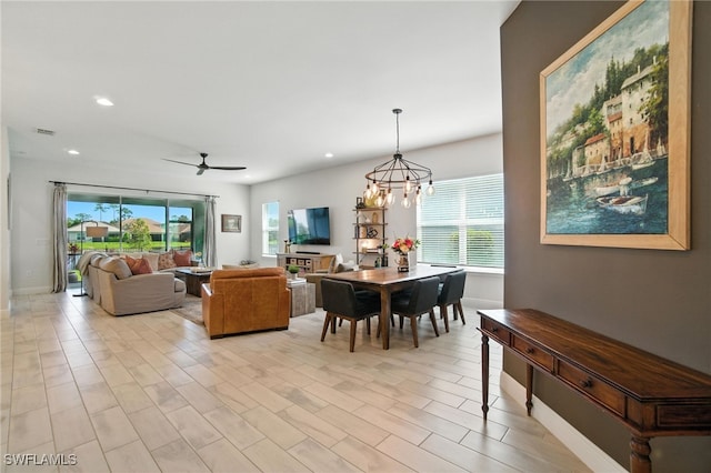 3387 Pilot Cir, Naples, FL 34120 - dining room with recessed lighting, a ceiling fan, and a chandelier