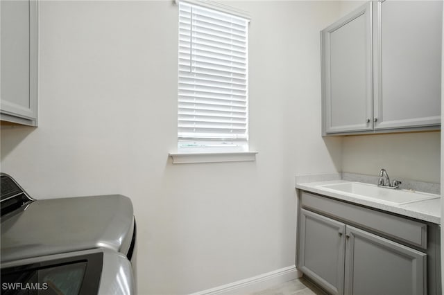 3387 Pilot Cir, Naples, FL 34120 - washroom featuring independent washer and dryer and cabinet space