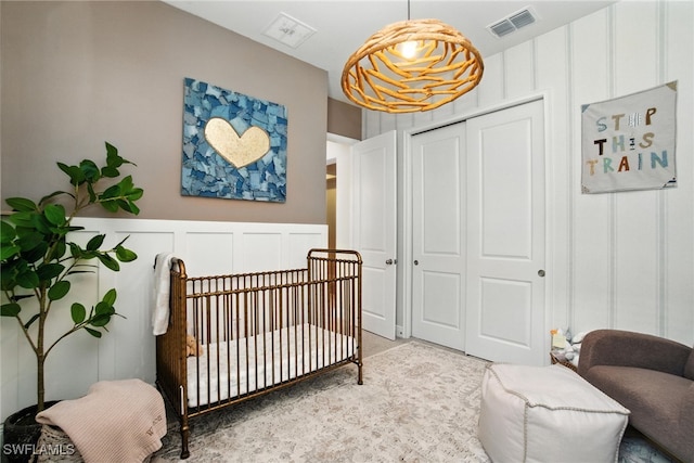 3387 Pilot Cir, Naples, FL 34120 - bedroom with a decorative wall, a closet, and a nursery area