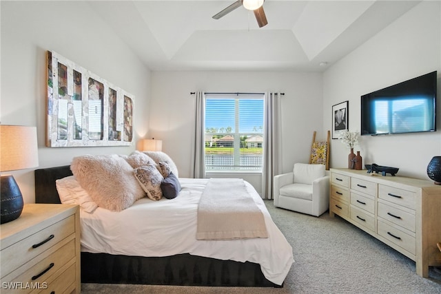 3387 Pilot Cir, Naples, FL 34120 - bedroom featuring a raised ceiling, light colored carpet, and a ceiling fan