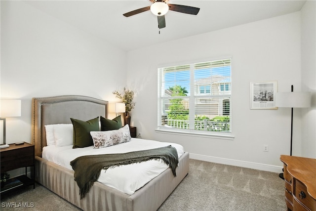 3387 Pilot Cir, Naples, FL 34120 - carpeted bedroom with baseboards and ceiling fan