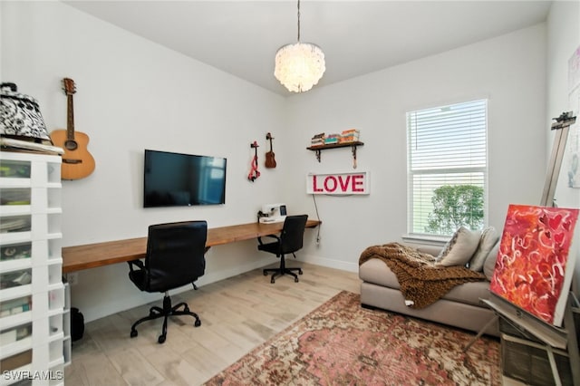 3387 Pilot Cir, Naples, FL 34120 - office with wood finished floors and a chandelier