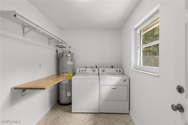 4811 Shady River Ln, Fort Myers, FL 33905 - laundry room featuring electric water heater, separate washer and dryer, a textured ceiling, and light marble finish flooring