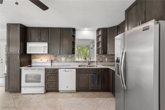 4811 Shady River Ln, Fort Myers, FL 33905 - kitchen with white appliances, open shelves, dark brown cabinets, and a textured ceiling