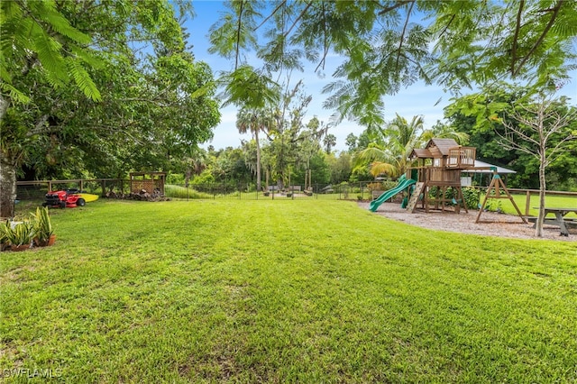 4811 Shady River Ln, Fort Myers, FL 33905 - view of yard featuring a playground and view of wooded area