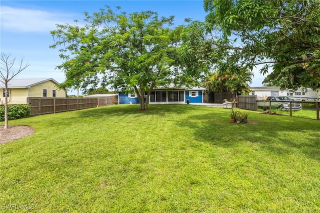 4811 Shady River Ln, Fort Myers, FL 33905 - fenced backyard with a sunroom