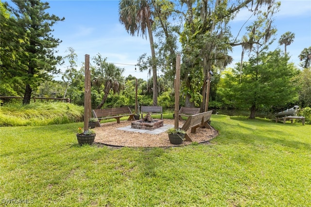 4811 Shady River Ln, Fort Myers, FL 33905 - view of green lawn featuring a fire pit
