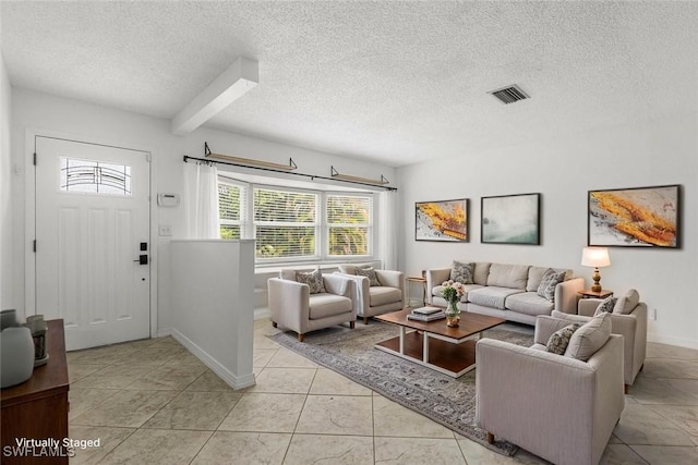 4811 Shady River Ln, Fort Myers, FL 33905 - living area with a textured ceiling and light tile patterned floors