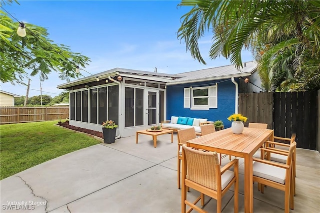 4811 Shady River Ln, Fort Myers, FL 33905 - rear view of property featuring a sunroom, a patio, a fenced backyard, a metal roof, and an outdoor hangout area