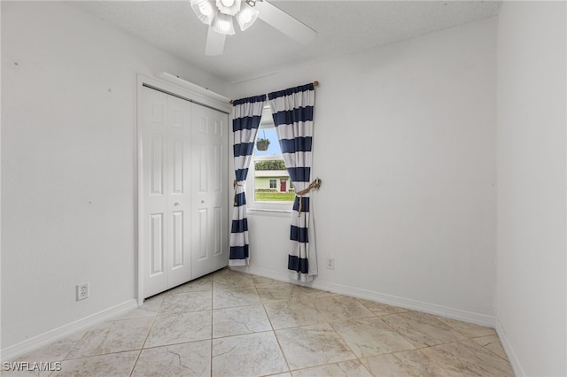 4811 Shady River Ln, Fort Myers, FL 33905 - unfurnished bedroom with a closet, marble finish floors, and ceiling fan