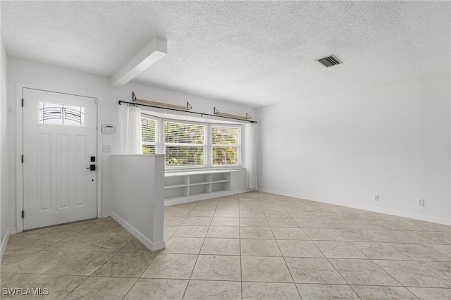 4811 Shady River Ln, Fort Myers, FL 33905 - entrance foyer with a textured ceiling and light tile patterned floors