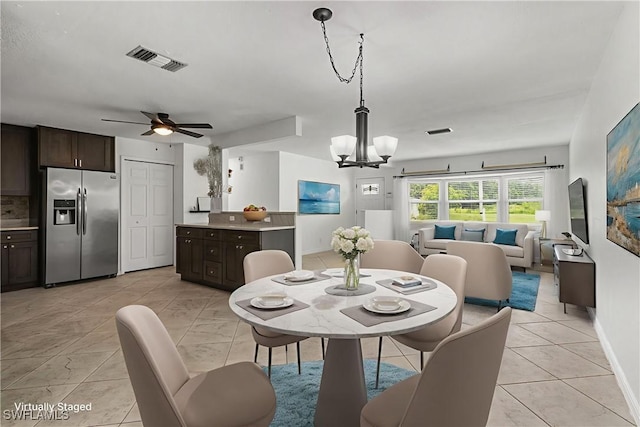 4811 Shady River Ln, Fort Myers, FL 33905 - dining room with a chandelier, a ceiling fan, and light marble finish floors