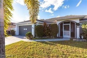 1843 Landale Loop, Lehigh Acres, FL 33972 - ranch-style home featuring concrete driveway, an attached garage, and a front lawn