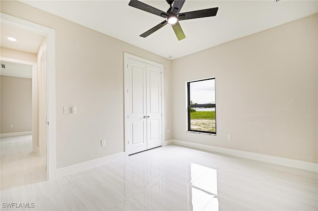 1117 SW Trafalgar Pkwy, Cape Coral, FL 33991 - unfurnished bedroom featuring a closet and a ceiling fan