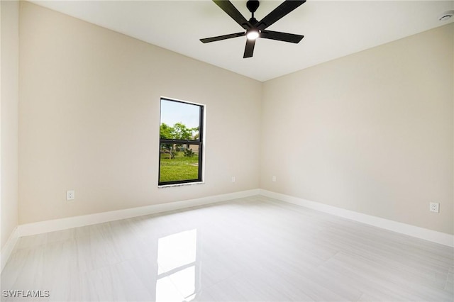 1117 SW Trafalgar Pkwy, Cape Coral, FL 33991 - unfurnished room with baseboards and a ceiling fan