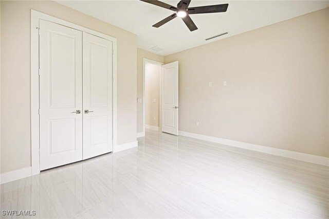 1117 SW Trafalgar Pkwy, Cape Coral, FL 33991 - unfurnished bedroom featuring a closet and ceiling fan