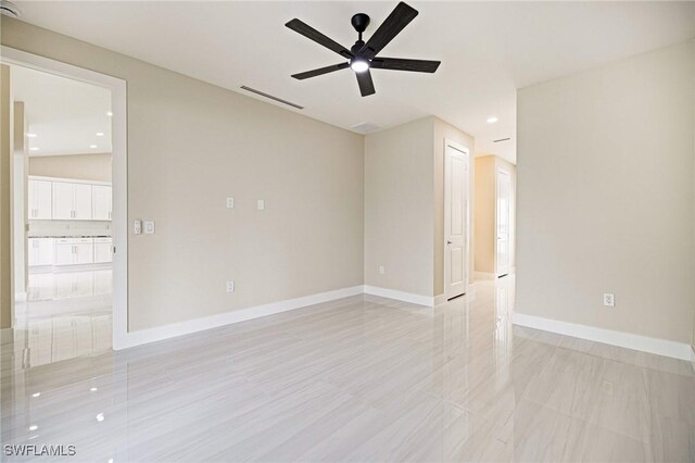 1117 SW Trafalgar Pkwy, Cape Coral, FL 33991 - spare room featuring ceiling fan and recessed lighting