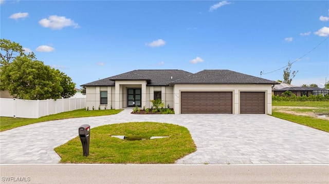 1117 SW Trafalgar Pkwy, Cape Coral, FL 33991 - view of front of house with curved driveway, stucco siding, and an attached garage