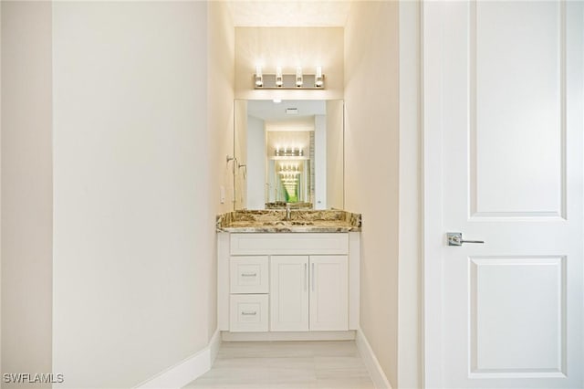 1117 SW Trafalgar Pkwy, Cape Coral, FL 33991 - bathroom with vanity and baseboards