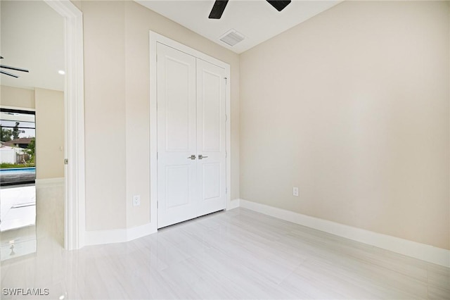 1117 SW Trafalgar Pkwy, Cape Coral, FL 33991 - unfurnished bedroom featuring a closet and ceiling fan