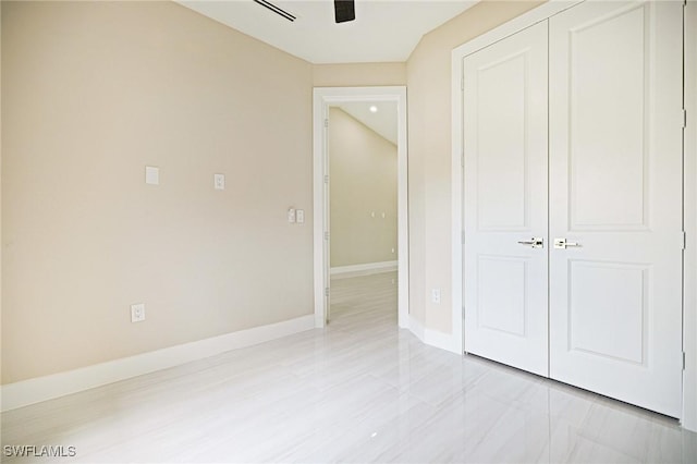 1117 SW Trafalgar Pkwy, Cape Coral, FL 33991 - unfurnished bedroom with a closet and a ceiling fan