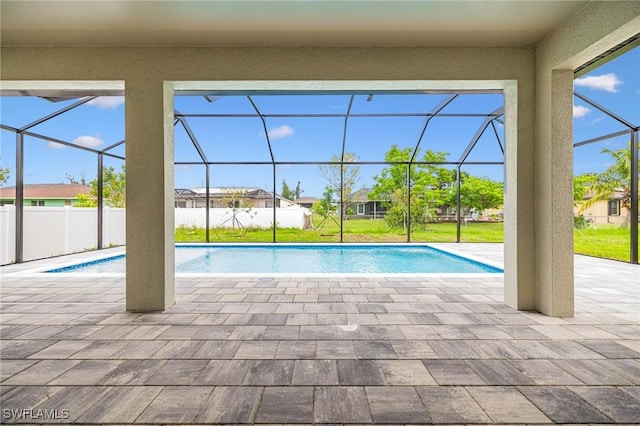 1117 SW Trafalgar Pkwy, Cape Coral, FL 33991 - view of swimming pool featuring a patio, glass enclosure, and a residential view