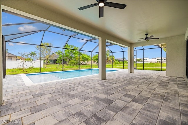 1117 SW Trafalgar Pkwy, Cape Coral, FL 33991 - outdoor pool featuring ceiling fan, a lawn, a patio, and a lanai