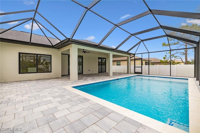 1117 SW Trafalgar Pkwy, Cape Coral, FL 33991 - view of swimming pool featuring a patio, a ceiling fan, and glass enclosure