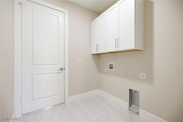 1117 SW Trafalgar Pkwy, Cape Coral, FL 33991 - laundry area featuring cabinet space, washer hookup, and electric dryer hookup