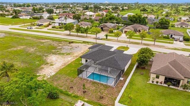 1117 SW Trafalgar Pkwy, Cape Coral, FL 33991 - aerial view of residential area with a pool area