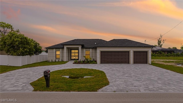1117 SW Trafalgar Pkwy, Cape Coral, FL 33991 - view of front facade featuring curved driveway, a garage, and stucco siding