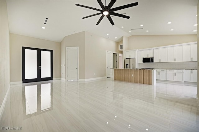 1328 SW 22nd Pl, Cape Coral, FL 33991 - unfurnished living room featuring french doors, a ceiling fan, light tile patterned floors, recessed lighting, and high vaulted ceiling