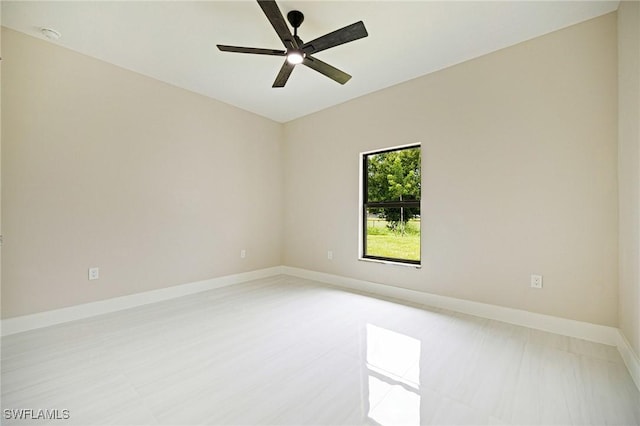 1328 SW 22nd Pl, Cape Coral, FL 33991 - empty room with baseboards and a ceiling fan