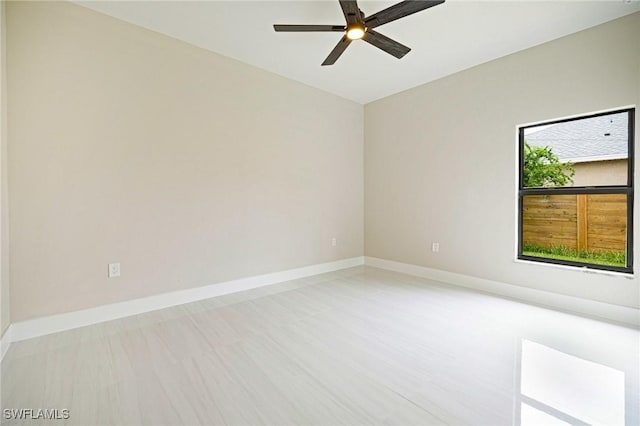 1328 SW 22nd Pl, Cape Coral, FL 33991 - empty room featuring a ceiling fan and baseboards