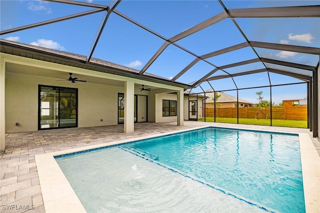 1328 SW 22nd Pl, Cape Coral, FL 33991 - view of pool featuring ceiling fan, a patio area, and glass enclosure