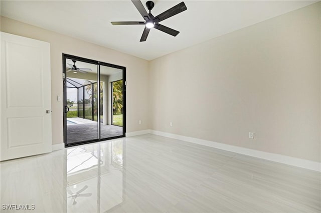 1328 SW 22nd Pl, Cape Coral, FL 33991 - empty room featuring baseboards and a ceiling fan