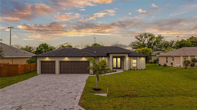 1328 SW 22nd Pl, Cape Coral, FL 33991 - view of front of home with decorative driveway, a garage, and stucco siding