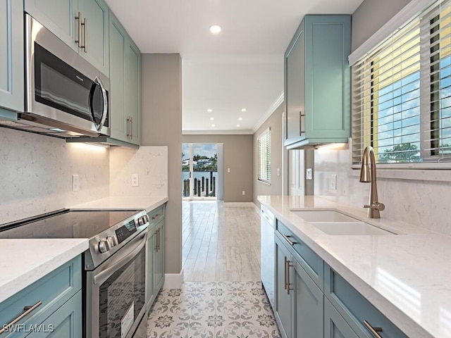 2500 Gulf Shore Blvd N Unit S9, Naples, FL 34103 - kitchen with stainless steel appliances, backsplash, ornamental molding, light stone countertops, and recessed lighting